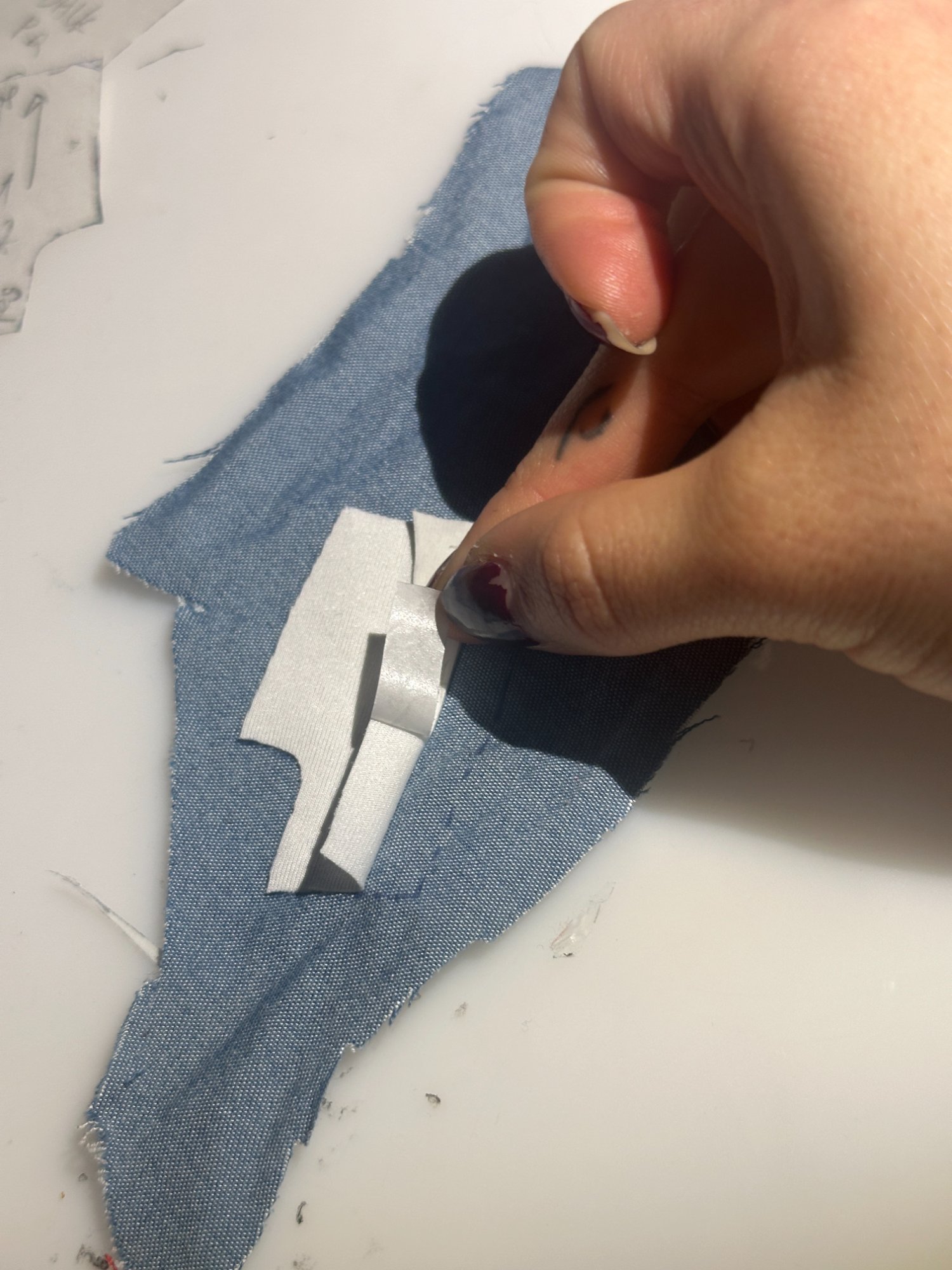 Cutting denim pieces with interfacing